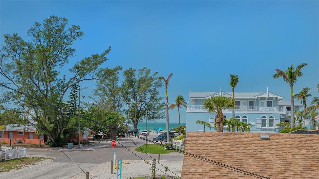 220 36th Street Holmes Beach, FL 34217 - Photo 38 of 59 a front view of a building with outdoor seating