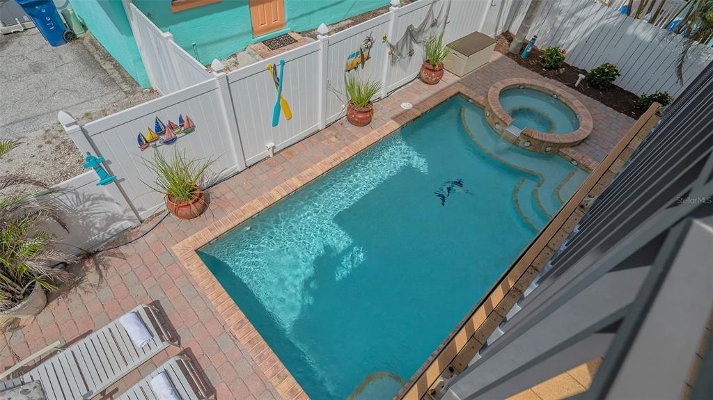 220 36th Street Holmes Beach, FL 34217 - Photo 39 of 59 a view of swimming pool from a balcony