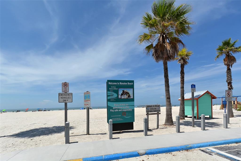 220 36th Street Holmes Beach, FL 34217 - Photo 50 of 59 a vase of flowers sitting on a table