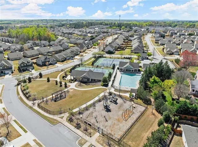an aerial view of residential houses with outdoor space