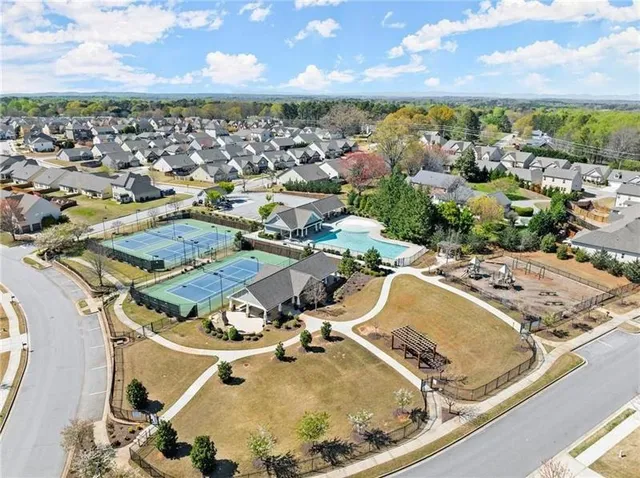 an aerial view of a house with a swimming pool