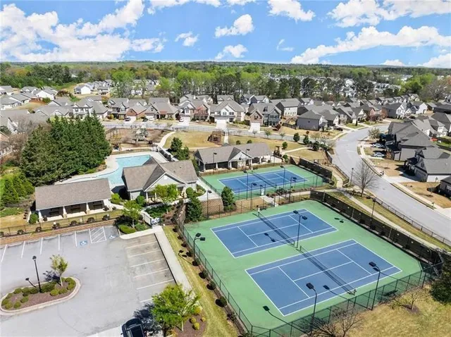 an aerial view of residential houses with outdoor space