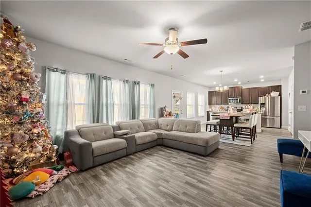 a living room with furniture and a large window