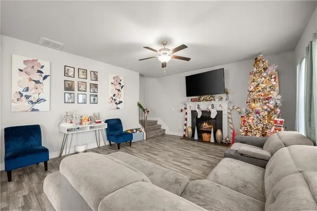 a living room with furniture and a flat screen tv