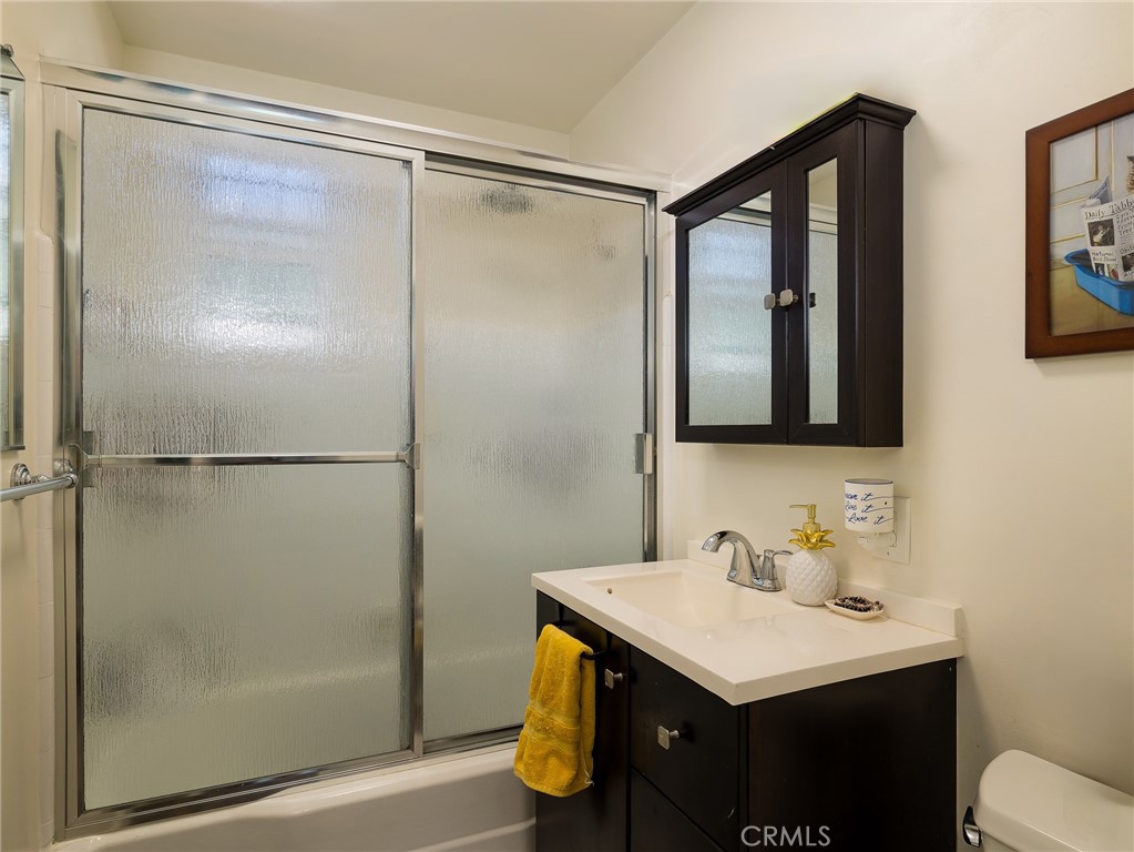 7019 Ramsgate Avenue Los Angeles, CA 90045 - Photo 13 of 19 a bathroom with a sink and mirror
