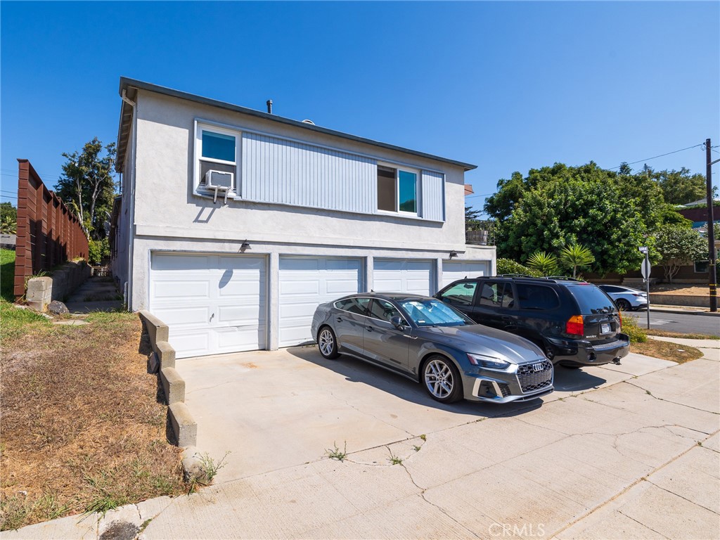 7019 Ramsgate Avenue Los Angeles, CA 90045 - Photo 14 of 19 a car parked in front of a house