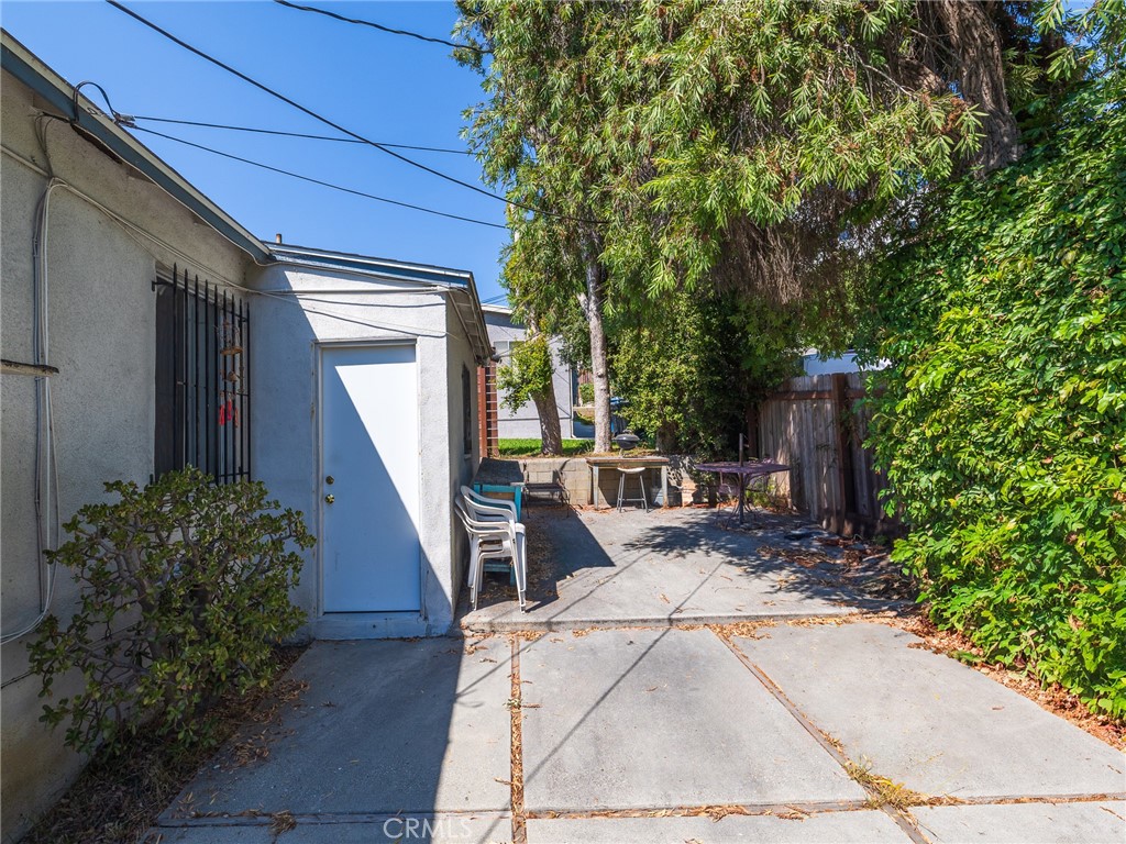7019 Ramsgate Avenue Los Angeles, CA 90045 - Photo 16 of 19 a view of a house with backyard and sitting area