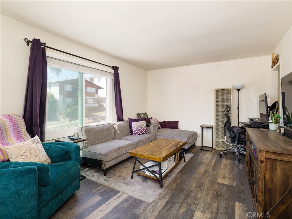 7019 Ramsgate Avenue Los Angeles, CA 90045 - Photo 6 of 19 a living room with furniture and a large window