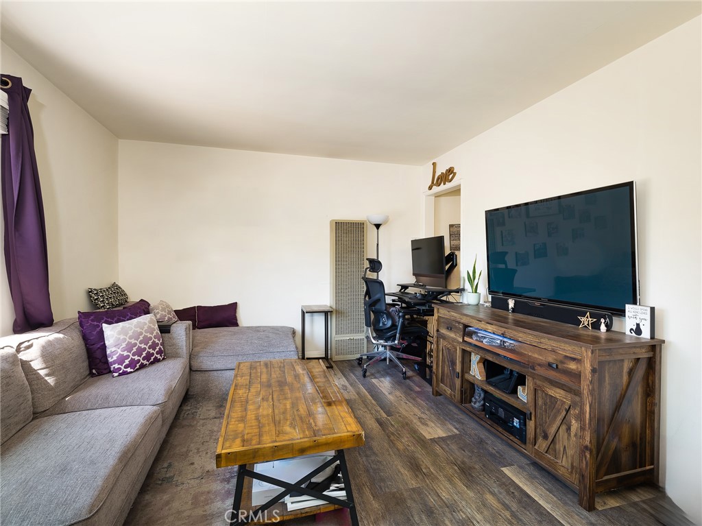 7019 Ramsgate Avenue Los Angeles, CA 90045 - Photo 7 of 19 a living room with furniture and a flat screen tv