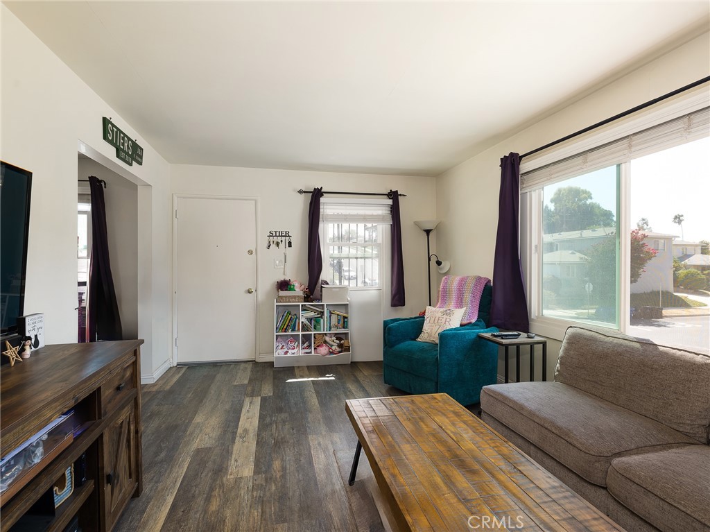 7019 Ramsgate Avenue Los Angeles, CA 90045 - Photo 8 of 19 a living room with furniture and a window