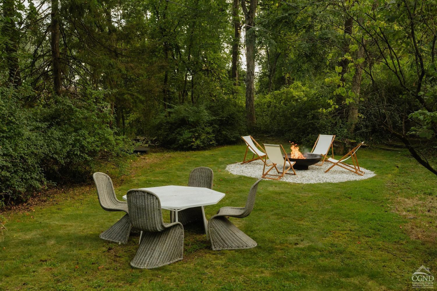 367 County Rt 2 Marbletown, NY 12404 - Photo 43 of 43 a view of a swimming pool with chair and table under an umbrella