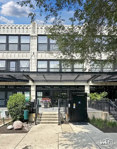 a front view of a building with garden