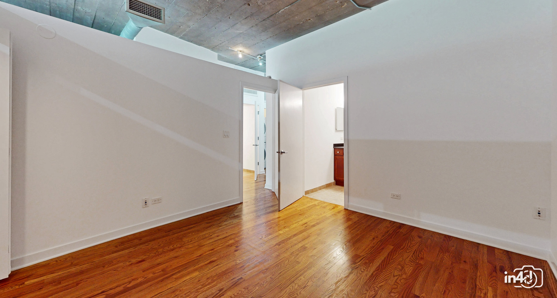 1150 West 15th Street, Unit 232 Chicago, IL 60608 - Photo 15 of 33 a view of empty room with wooden floor