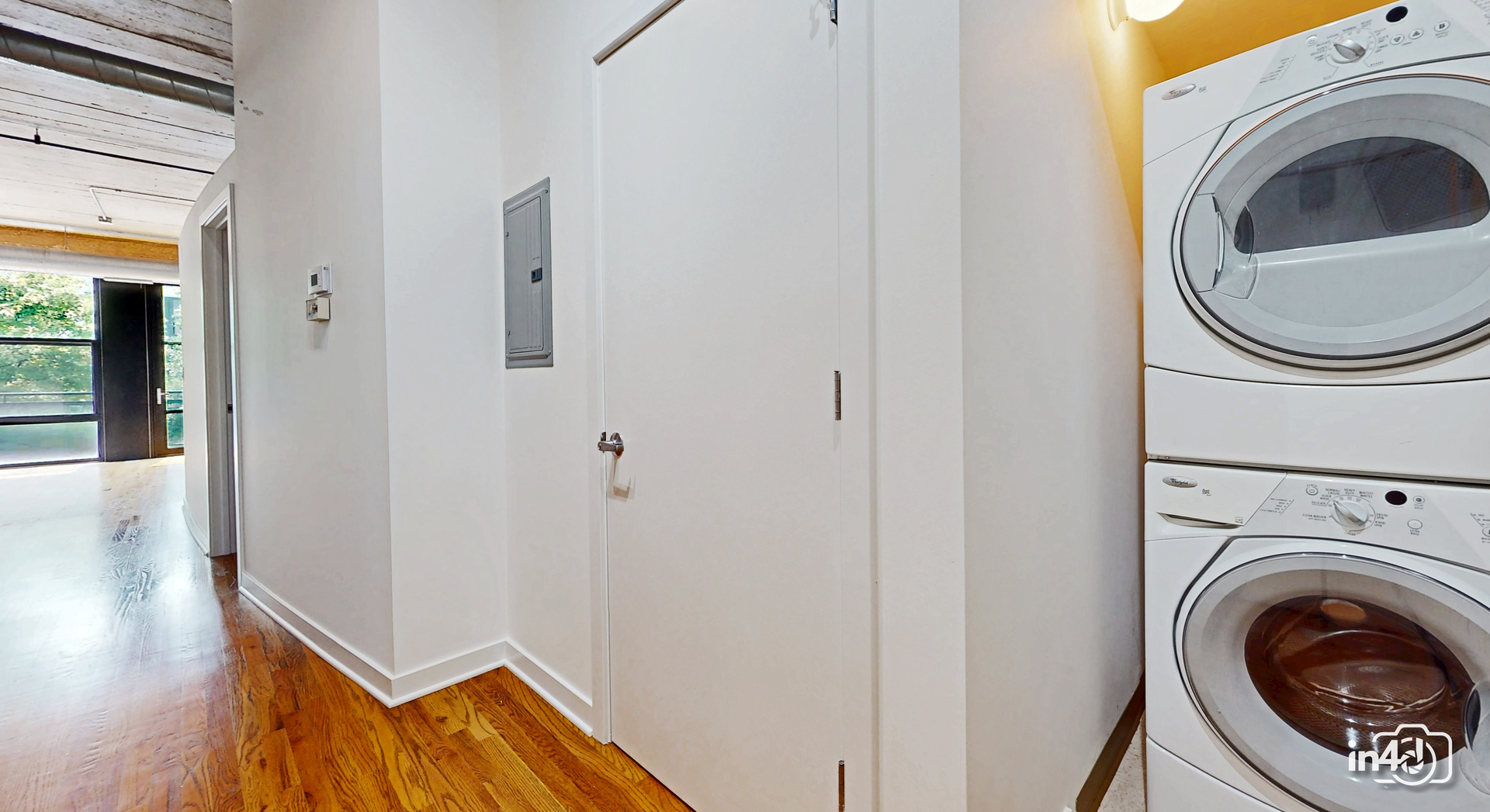 1150 West 15th Street, Unit 232 Chicago, IL 60608 - Photo 21 of 33 a view of a hallway with washer and dryer
