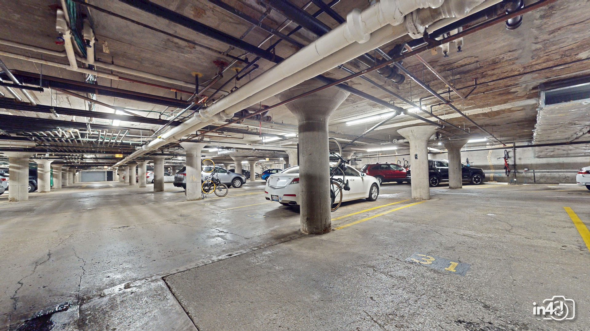 1150 West 15th Street, Unit 232 Chicago, IL 60608 - Photo 27 of 33 a view of parking garage with cars