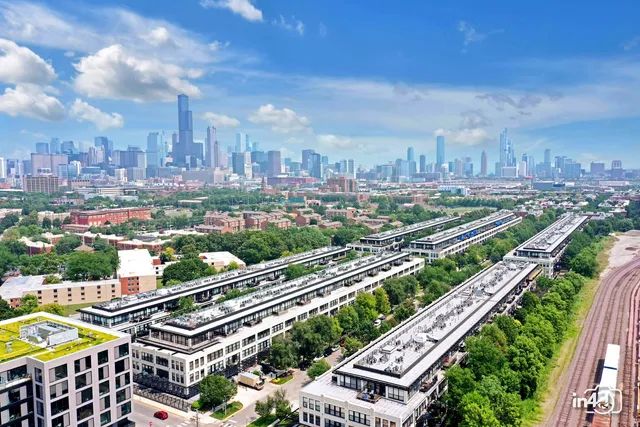 a view of people sitting in front of a building