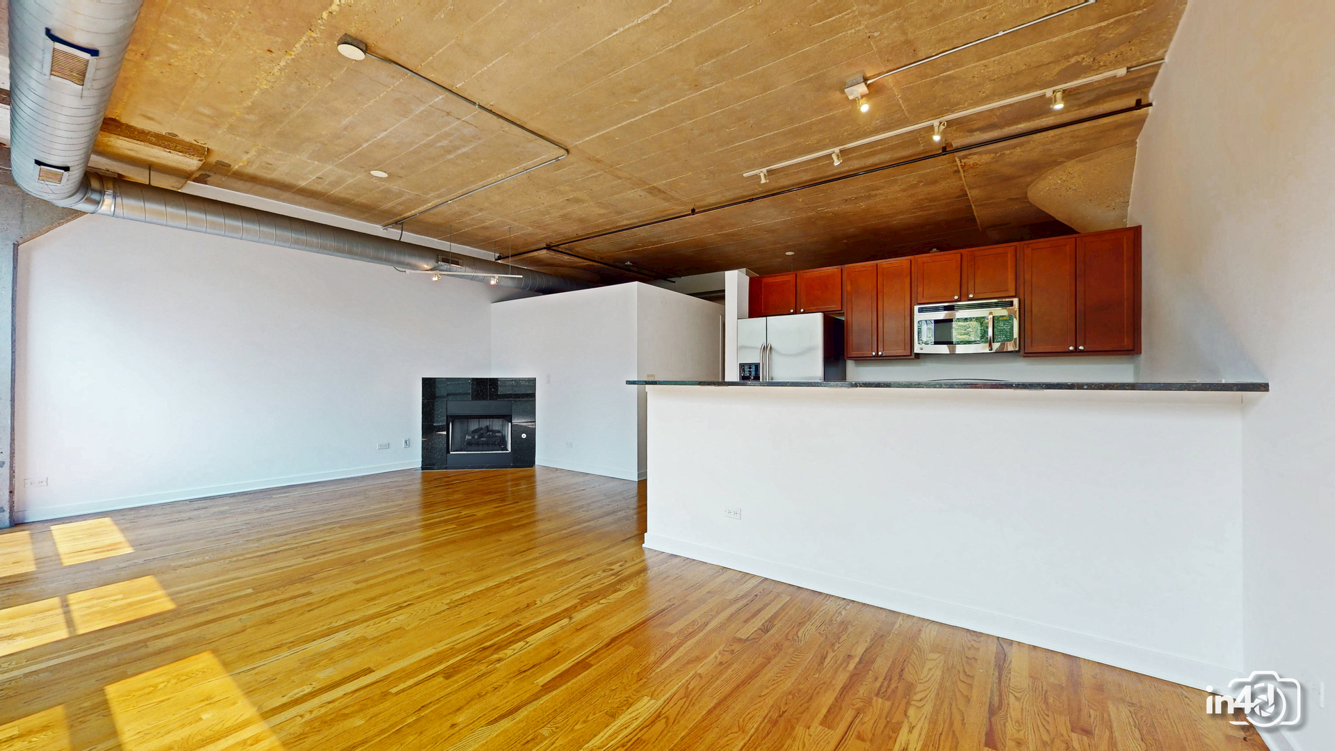 1150 West 15th Street, Unit 232 Chicago, IL 60608 - Photo 10 of 33 a view of a room with wooden floor