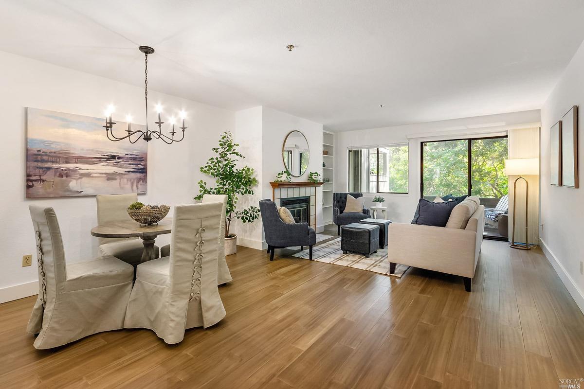 a living room with furniture dining table and a fireplace