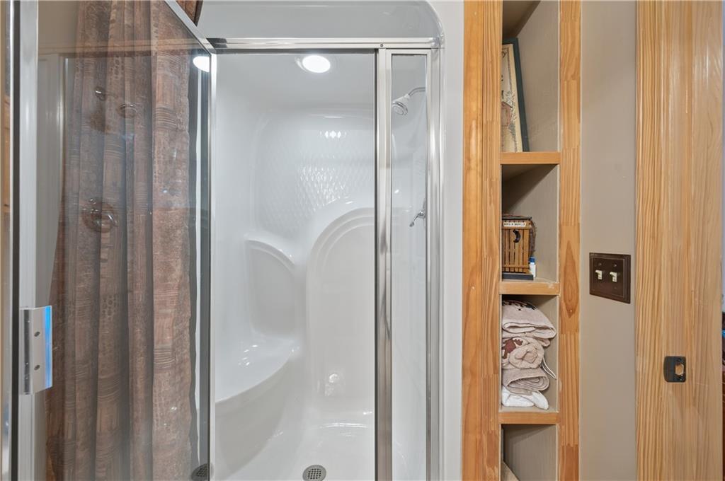 200 Bahn Innsbruck Helen, GA 30545 - Photo 25 of 84 a bathroom with a glass shower door and a sink