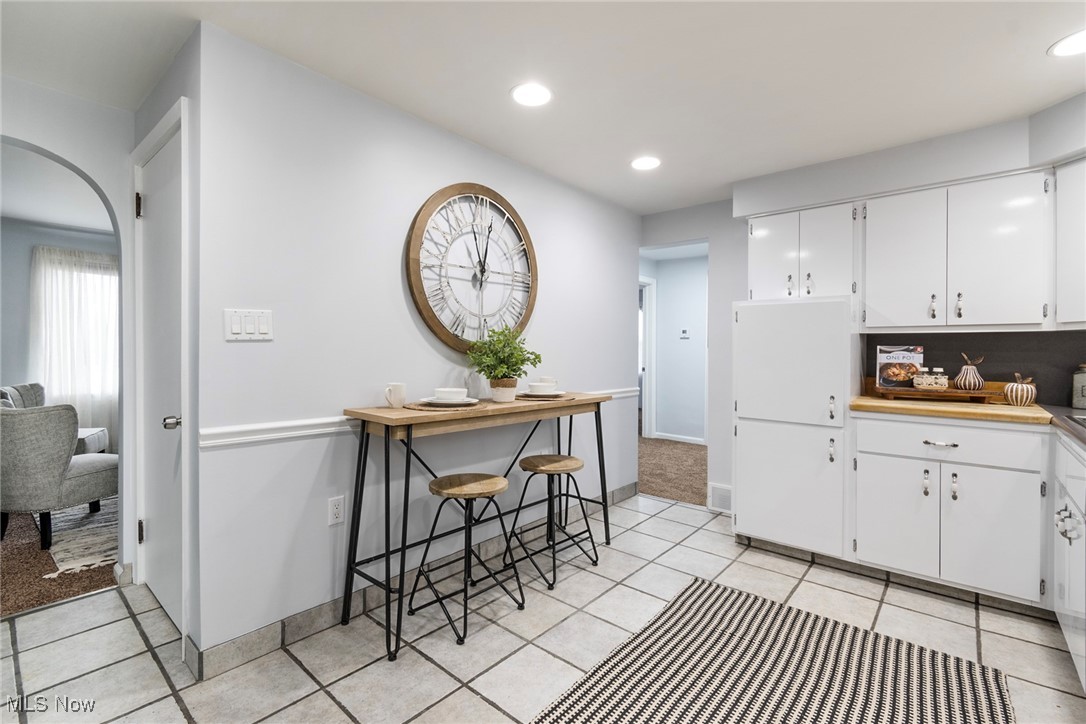 4188 Kirk Road Youngstown, OH 44511 - Photo 12 of 49 Kitchen with white cabinetry and light tile patterned floors