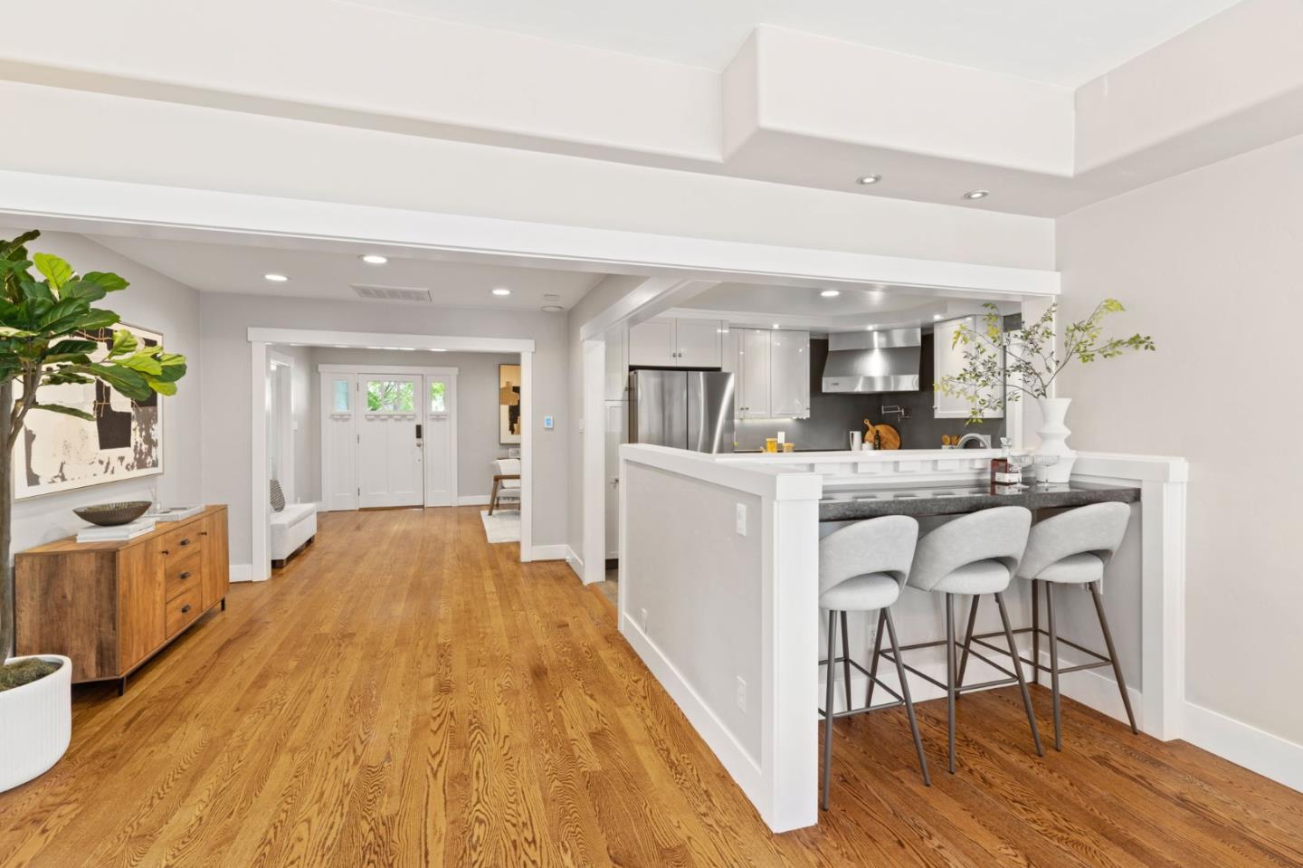 1426 Walnut Drive Campbell, CA 95008 - Photo 13 of 52 a living room with kitchen island granite countertop wooden floor and a dining table