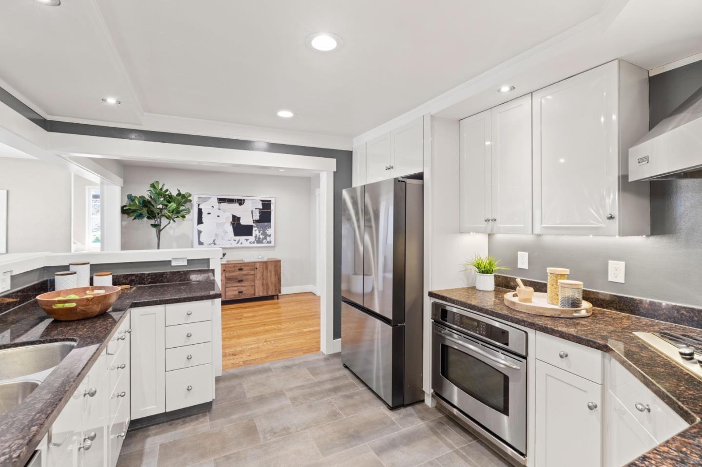 1426 Walnut Drive Campbell, CA 95008 - Photo 15 of 52 a kitchen with white cabinets and stainless steel appliances