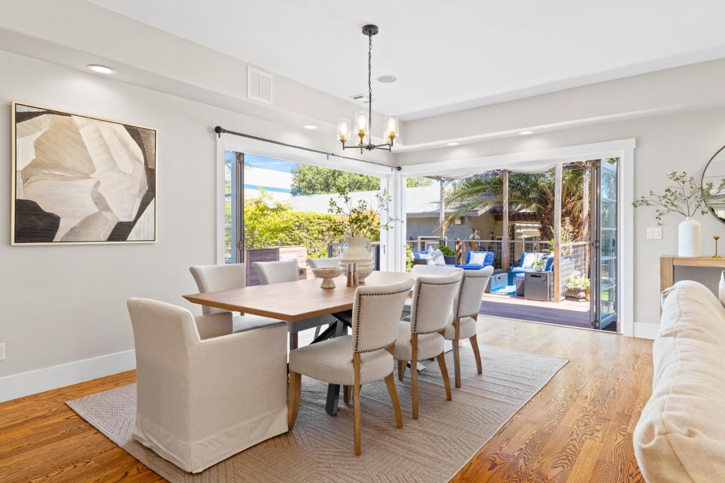 1426 Walnut Drive Campbell, CA 95008 - Photo 17 of 52 a dining room with furniture a chandelier and wooden floor
