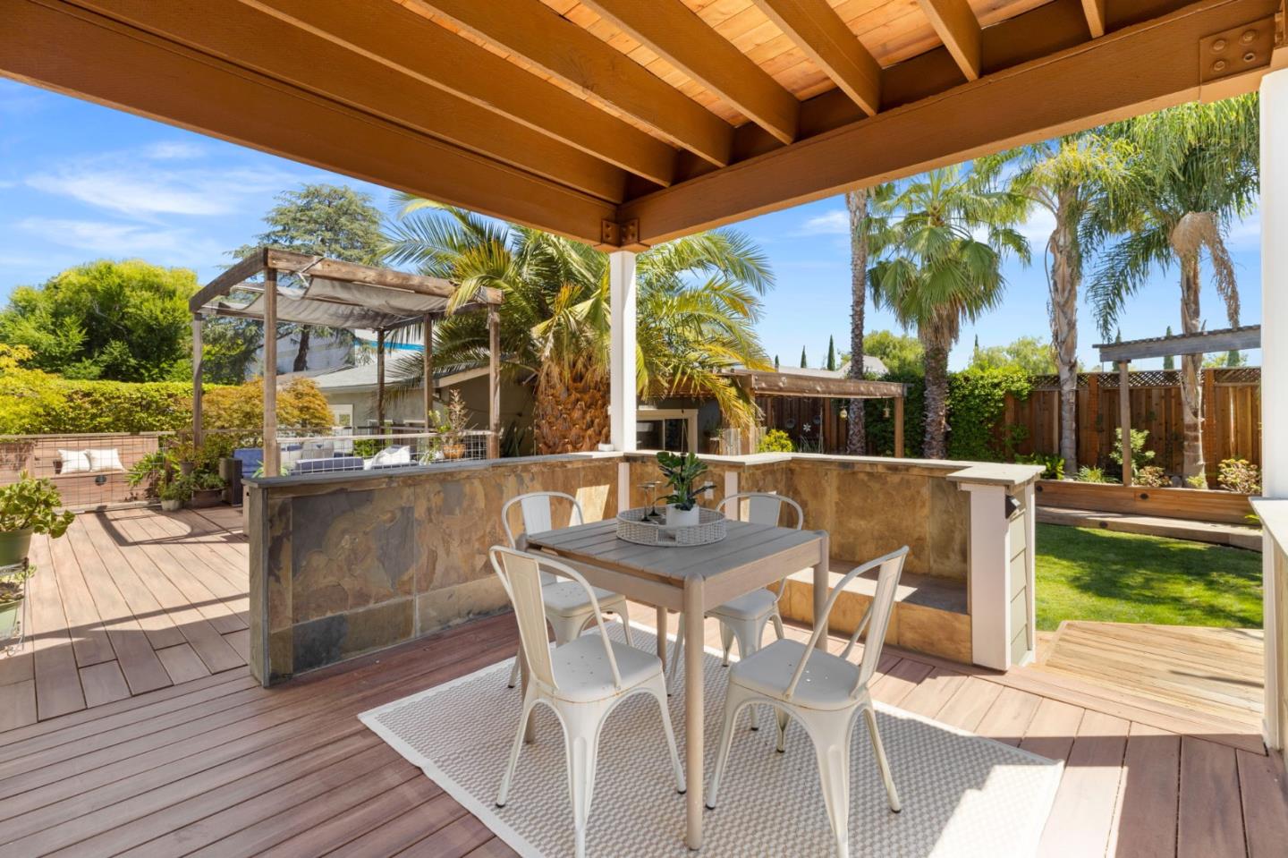 1426 Walnut Drive Campbell, CA 95008 - Photo 32 of 52 a view of a patio with table and chairs and potted plants