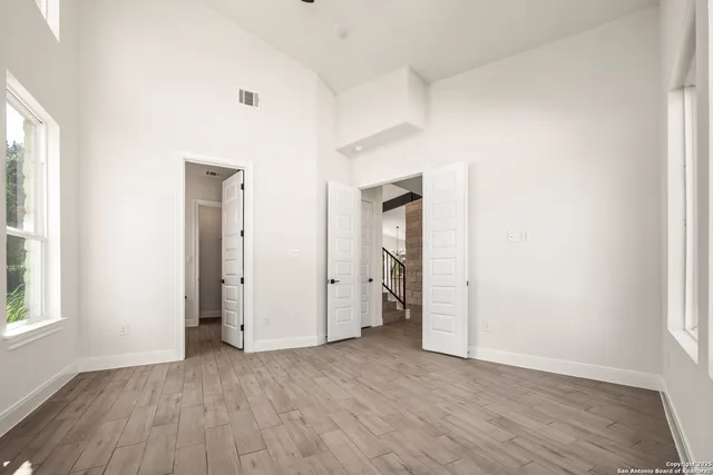 a bathroom with a double vanity sink a mirror and a shower