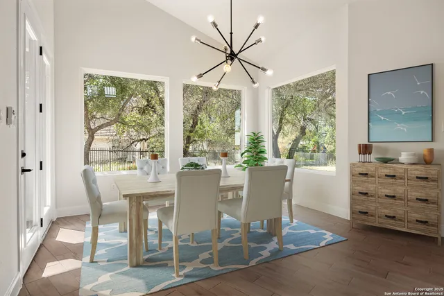 a view of a dining room with furniture window and outside view
