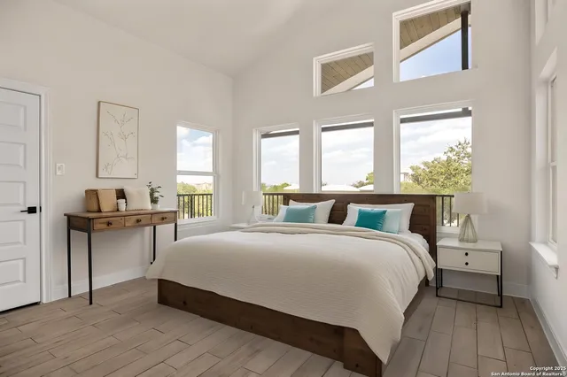 a bedroom with a bed and a table