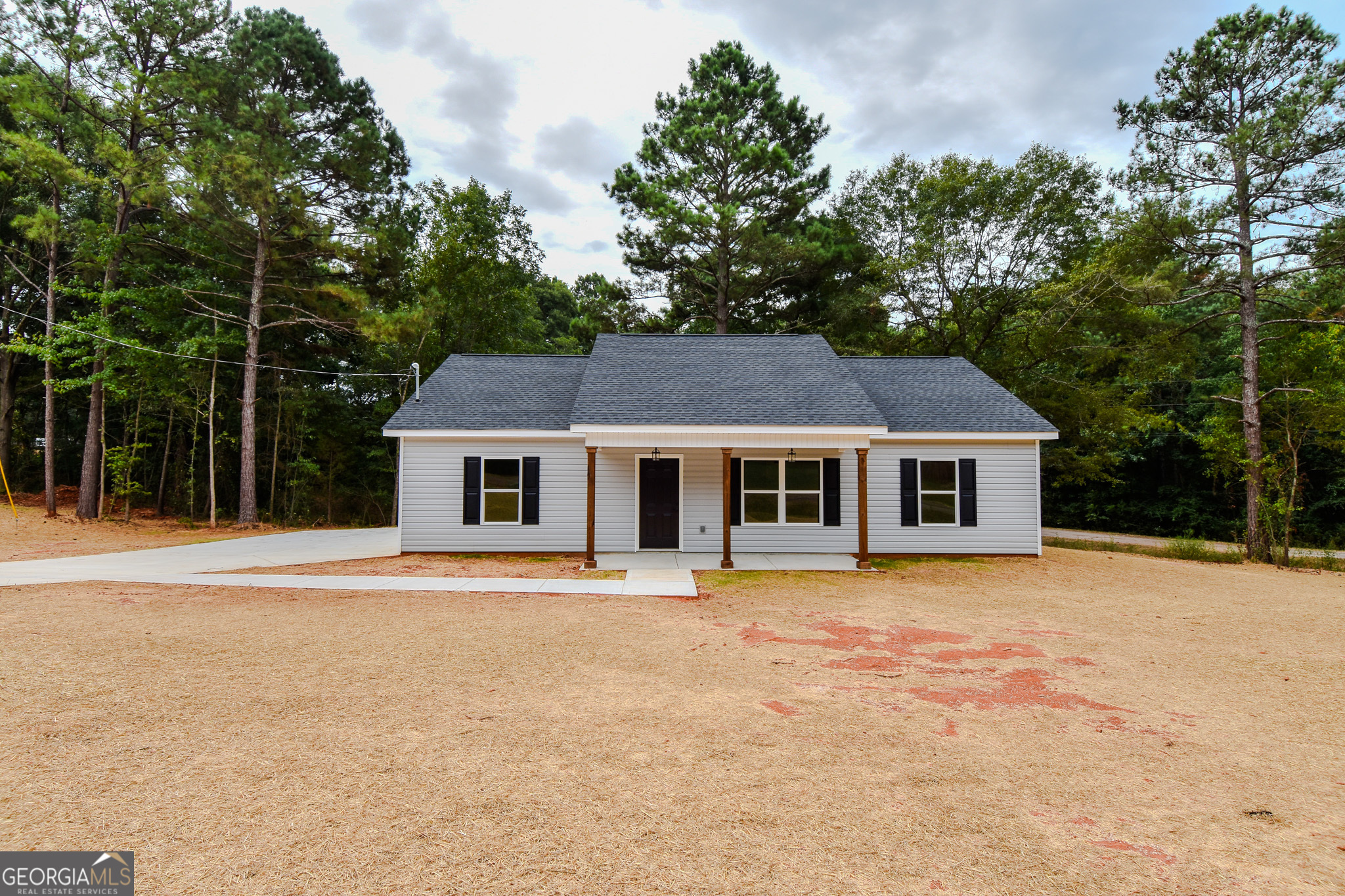 101 Alexandria Way Thomaston, GA 30286 - Photo 1 of 39 a front view of a house with a yard