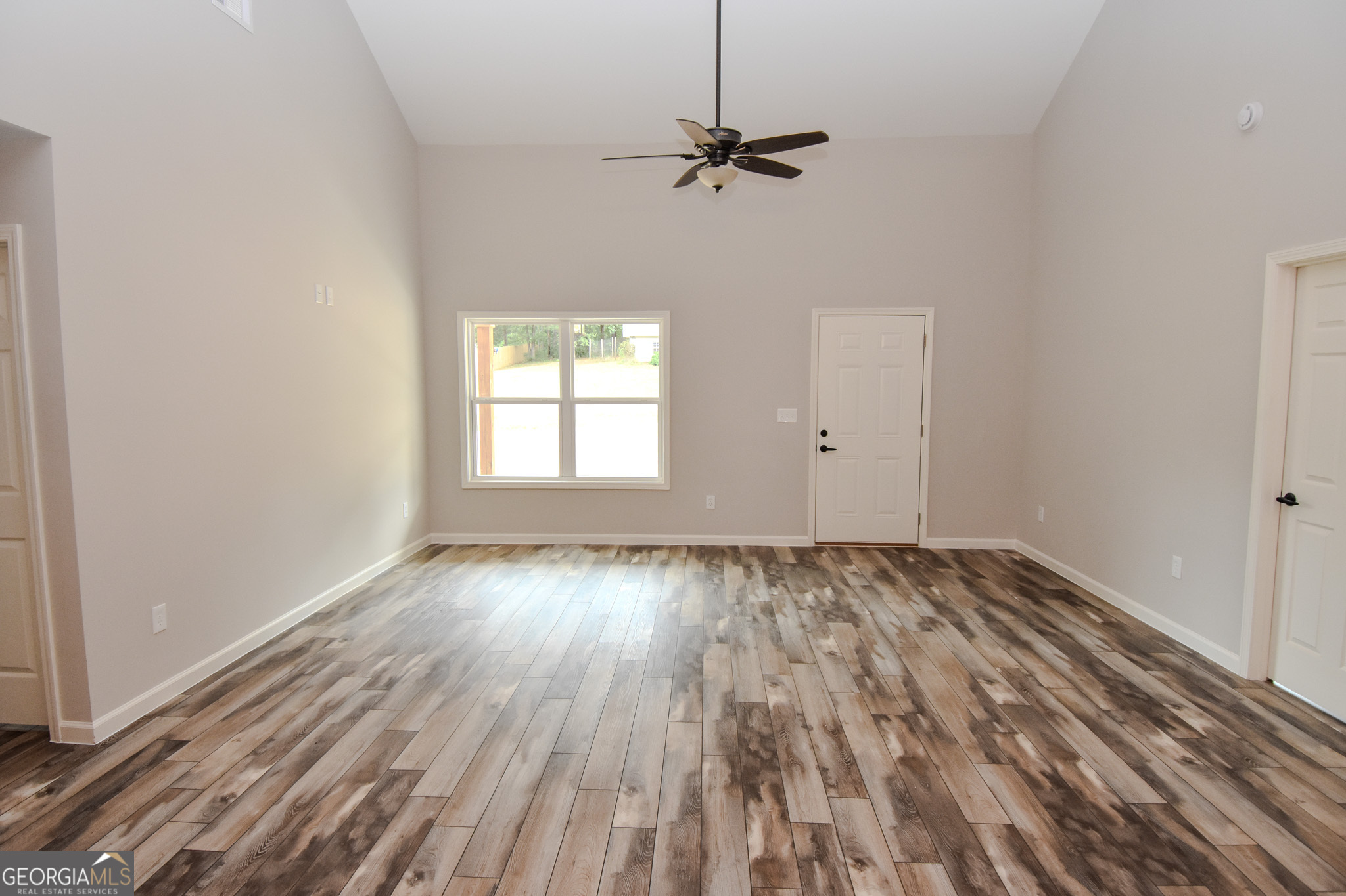 101 Alexandria Way Thomaston, GA 30286 - Photo 30 of 39 a view of empty room with wooden floor and fan