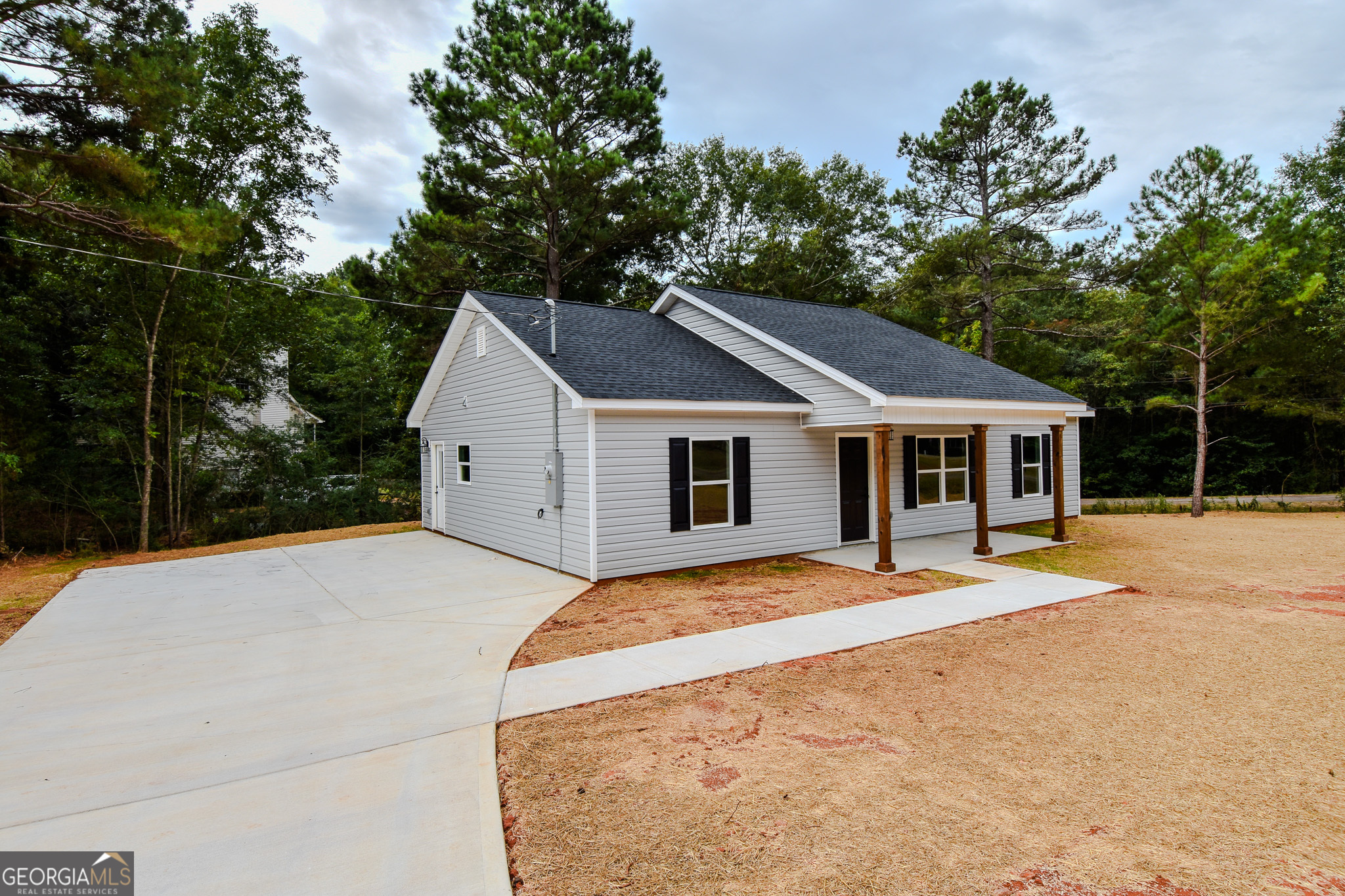 101 Alexandria Way Thomaston, GA 30286 - Photo 3 of 39 a house with trees in the background