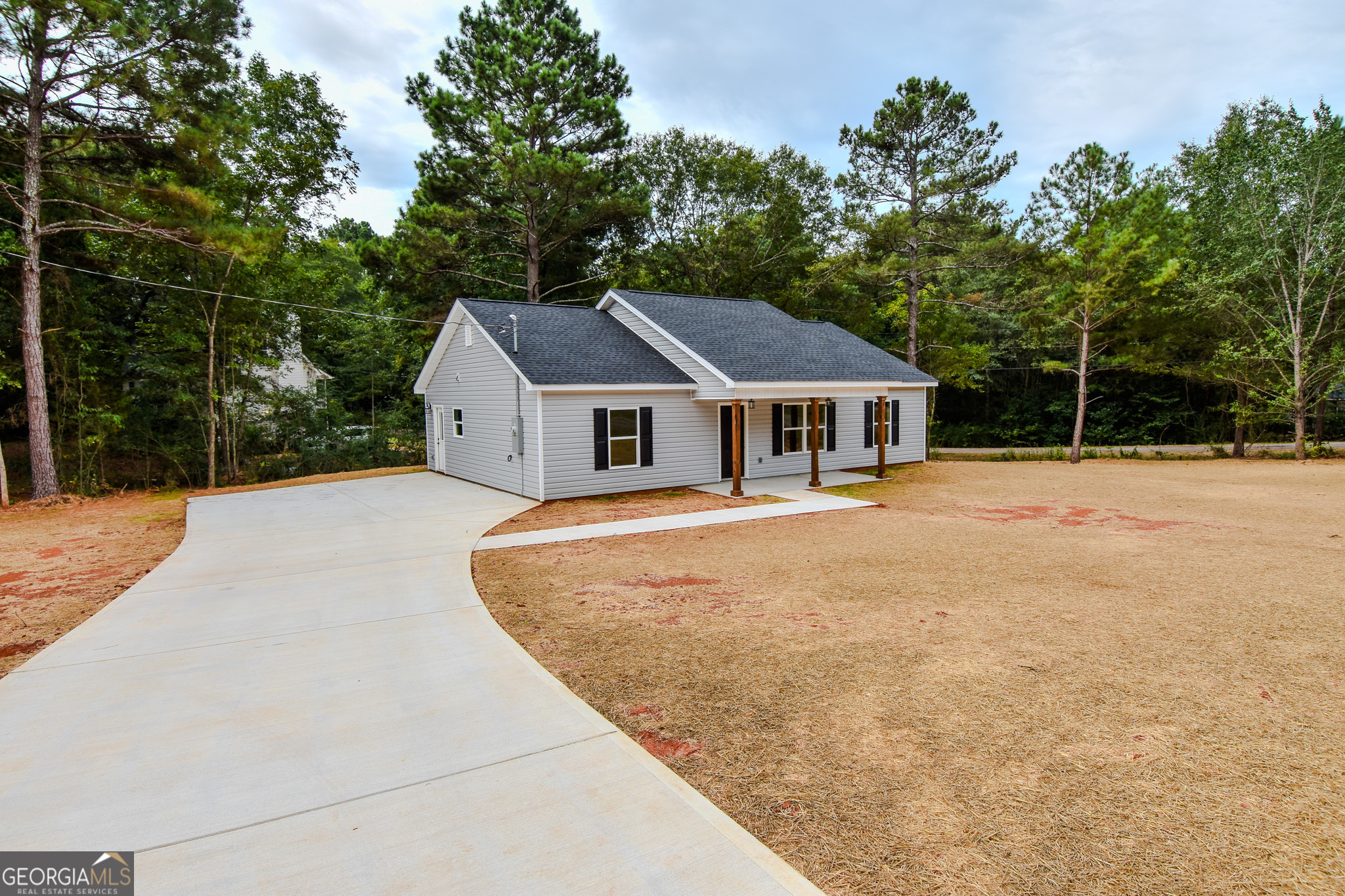 101 Alexandria Way Thomaston, GA 30286 - Photo 4 of 39 a house with trees in the background