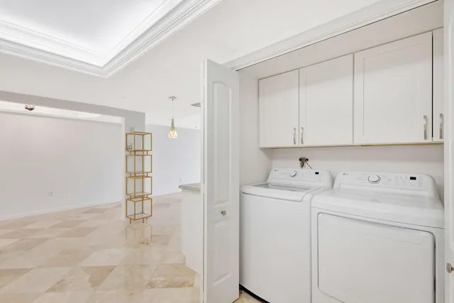 a front view of a house with a garden and plants