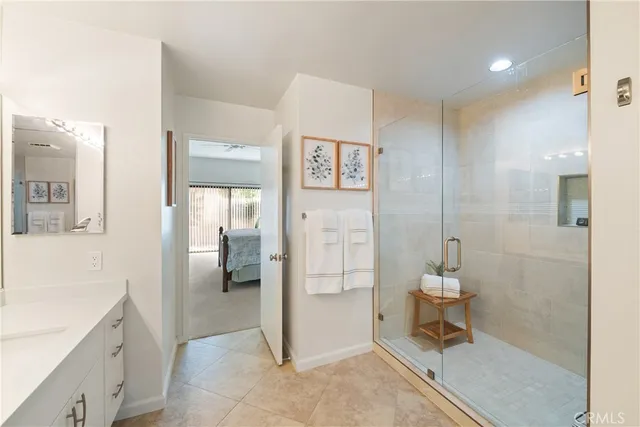 a spacious bathroom with a shower and a toilet