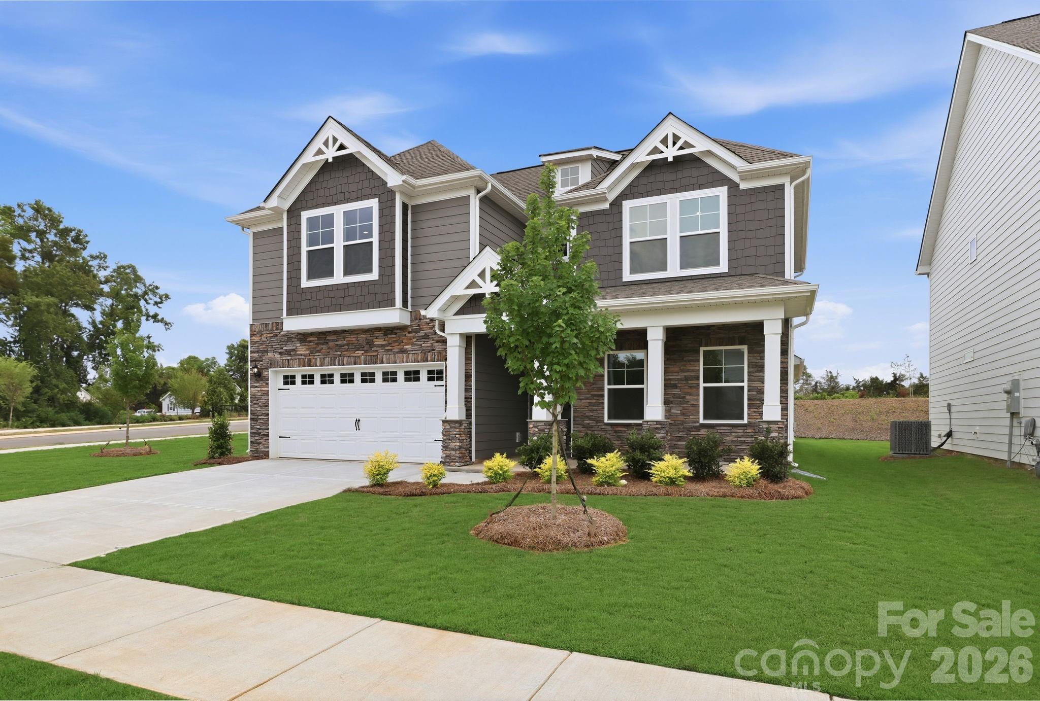 470 Brick House Road York, SC 29745 - Photo 4 of 39 a front view of a house with a yard and garage