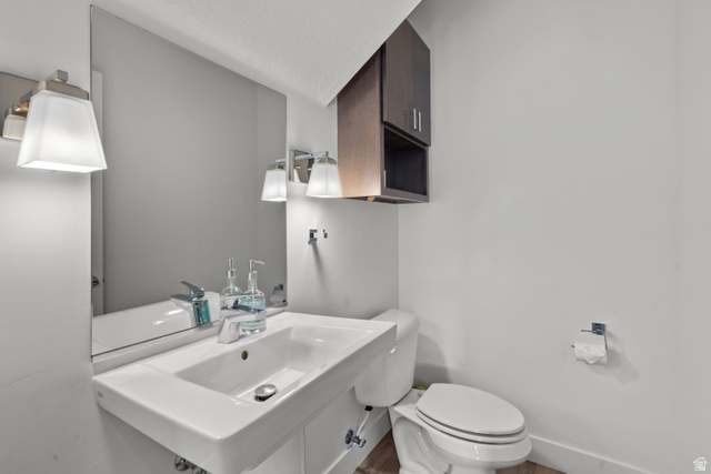 1122 South 1790th West, Unit 1 St. George, UT 84770 - Photo 12 of 37 Modern vanity with a rectangular basin sink, chrome faucet, and expansive wall mirror
