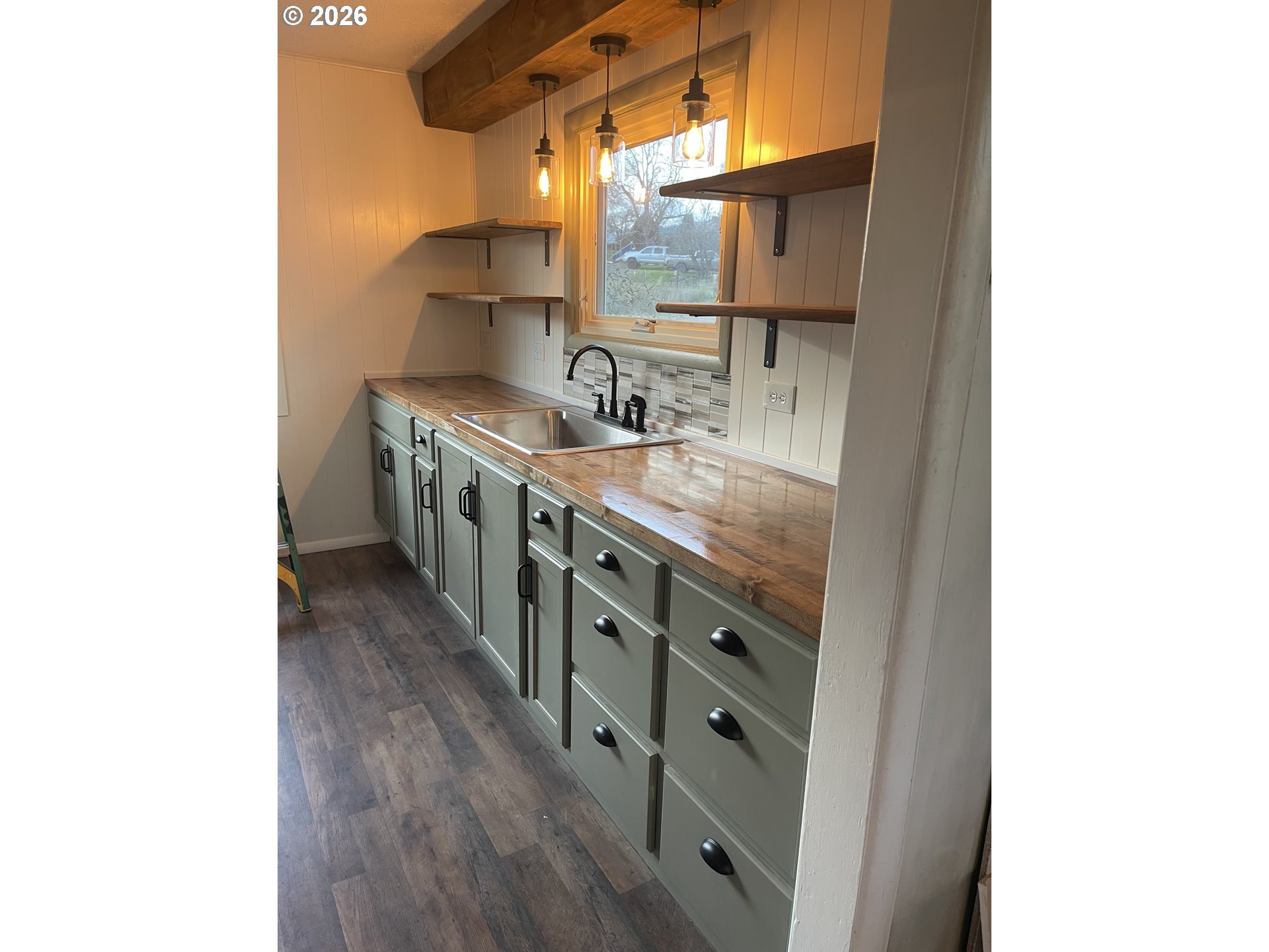 6404 Lookingglass Road Roseburg, OR 97471 - Photo 42 of 48 a kitchen with stainless steel appliances granite countertop a sink and a stove