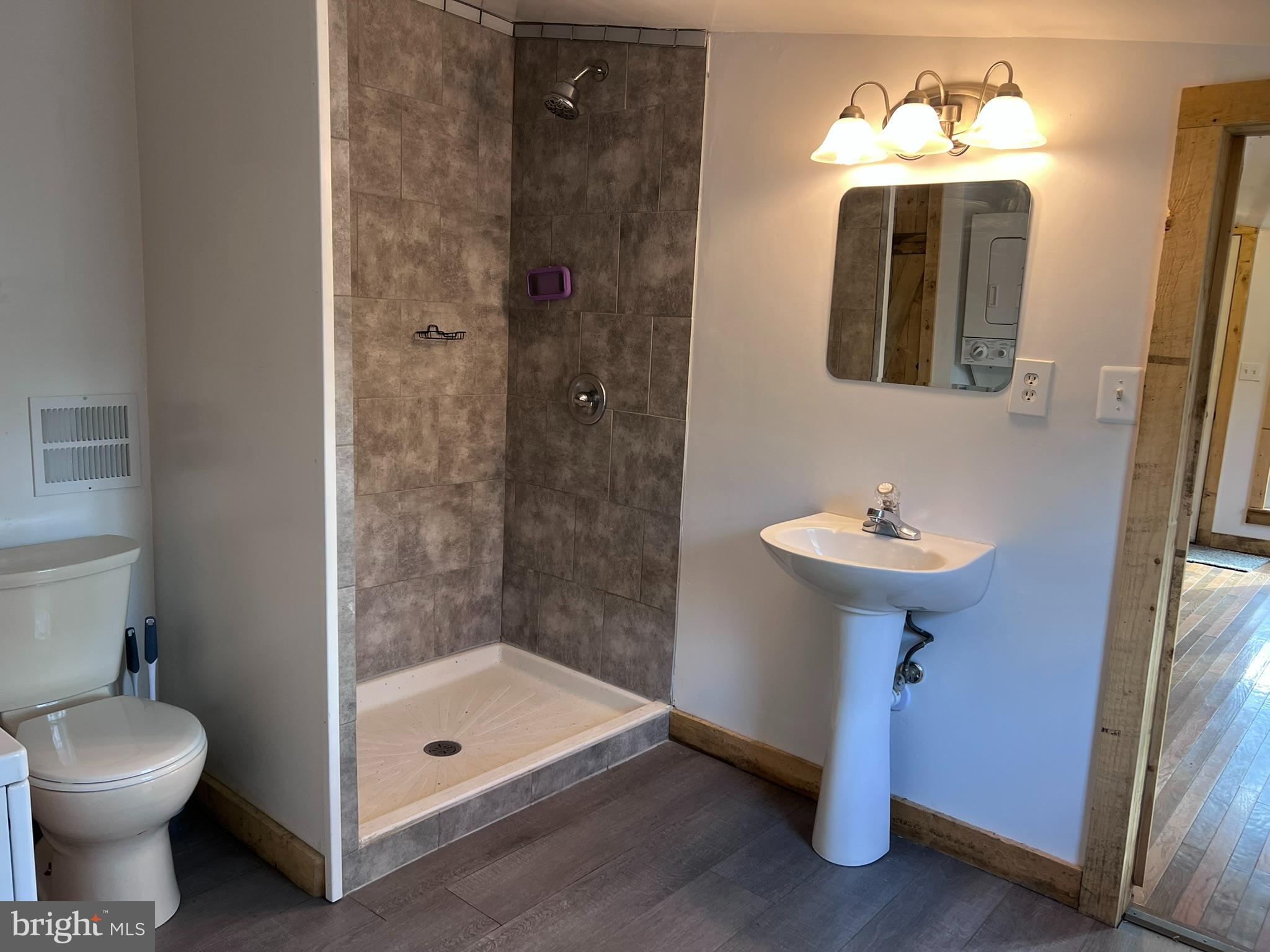 1 Punte Lane Essex, MD 21221 - Photo 6 of 37 a bathroom with a sink toilet and shower