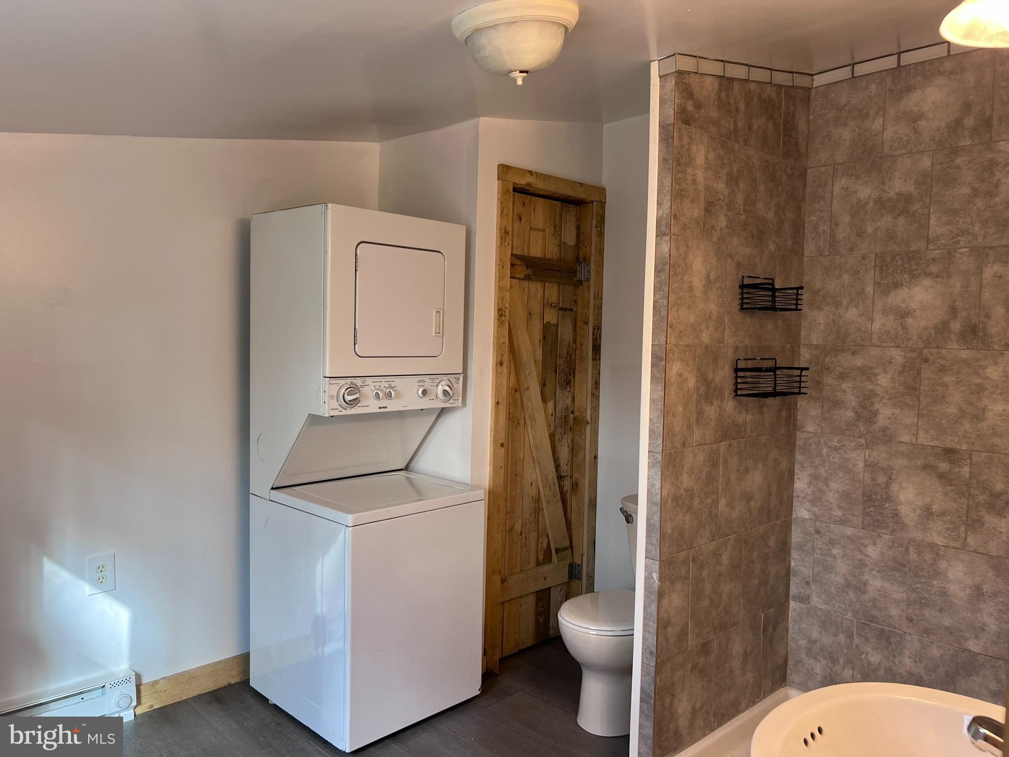 1 Punte Lane Essex, MD 21221 - Photo 7 of 37 a bathroom with a sink a toilet and shower