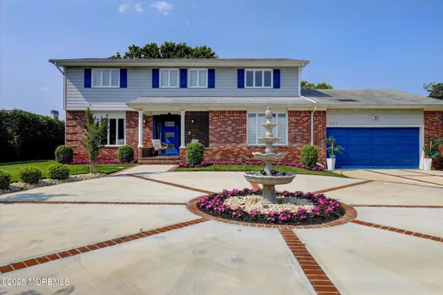 a front view of a house with yard