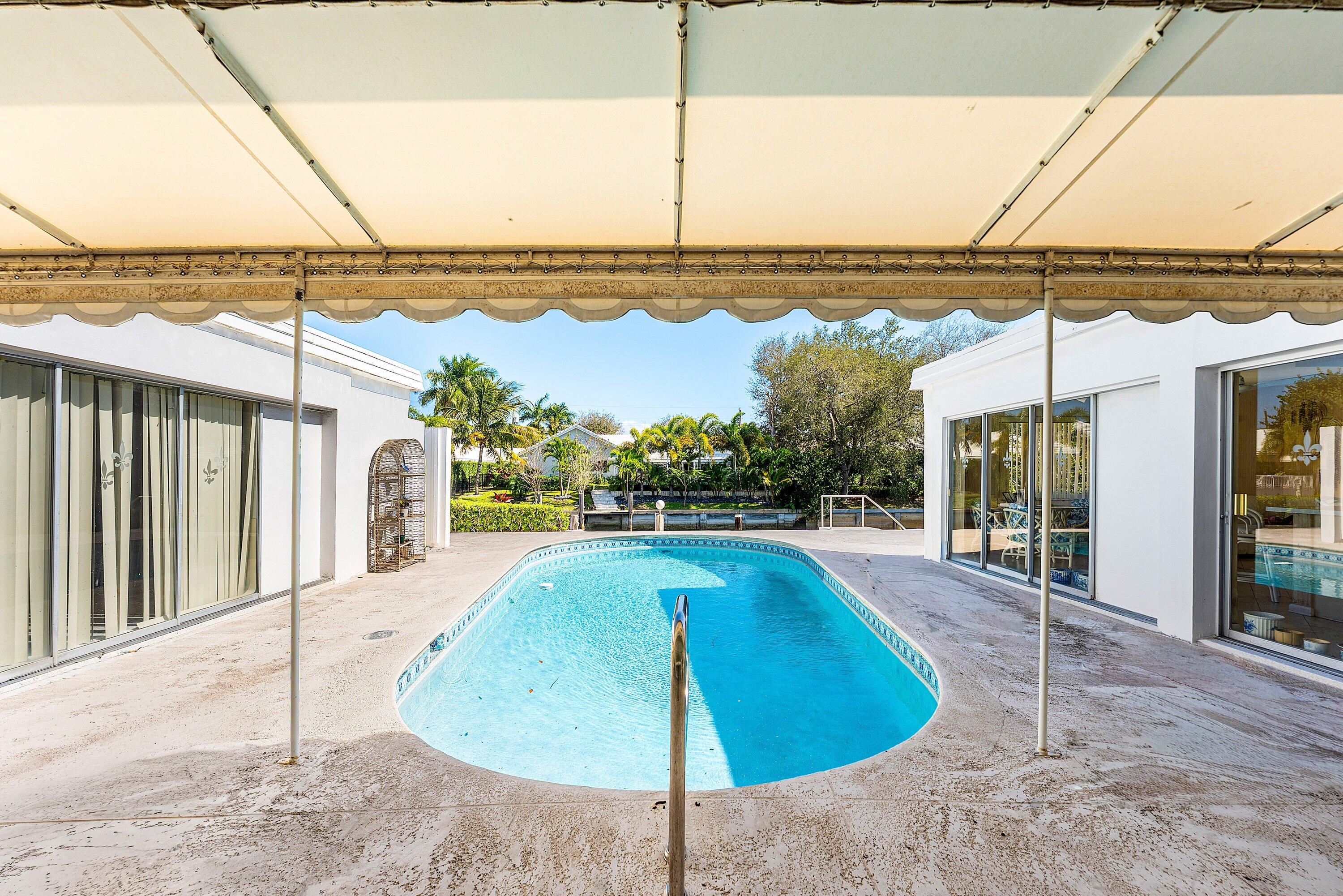 950 Mulberry Way Boca Raton, FL 33486 - Photo 12 of 23 a view of a swimming pool with a lake view