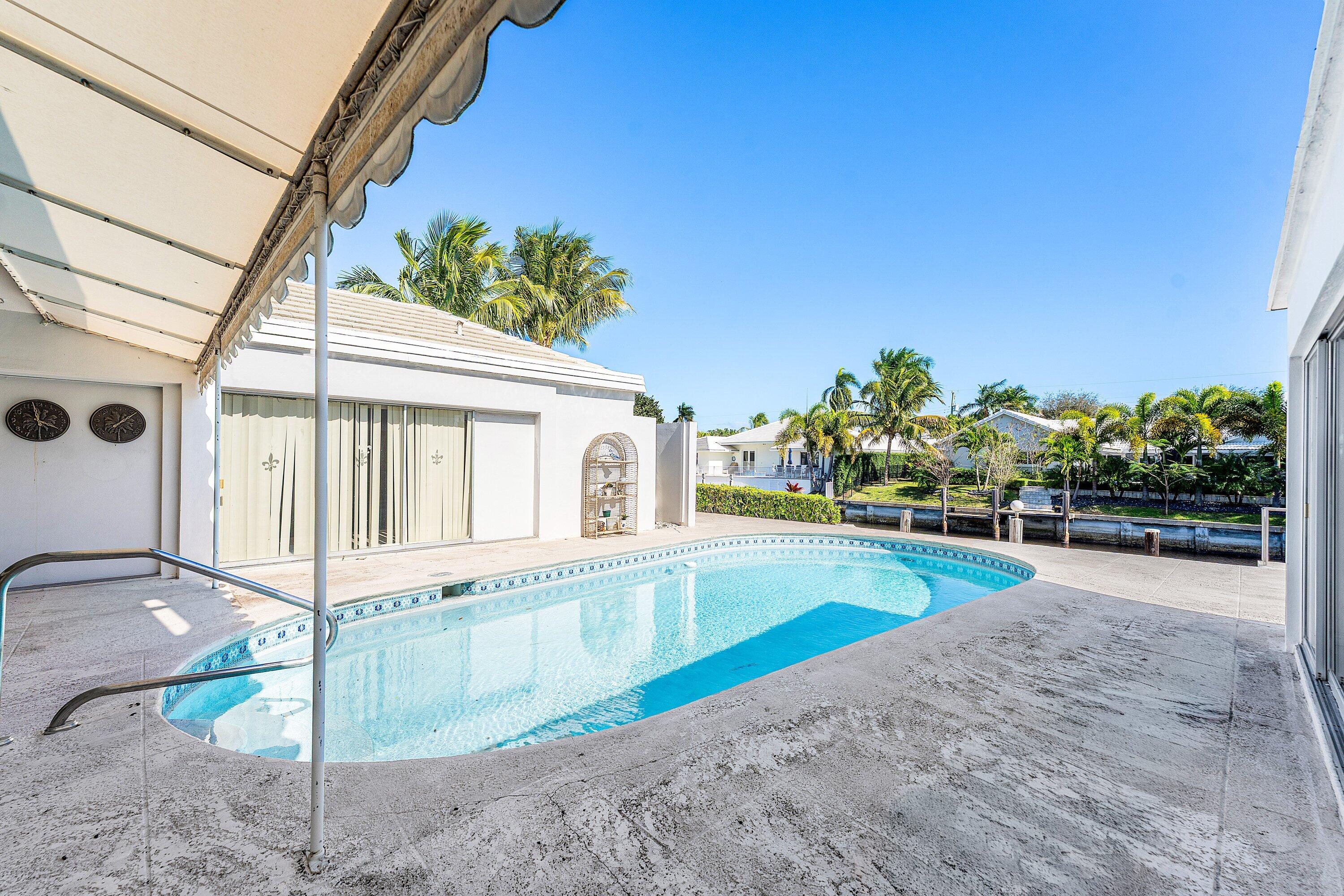 950 Mulberry Way Boca Raton, FL 33486 - Photo 13 of 23 a view of a house with a yard