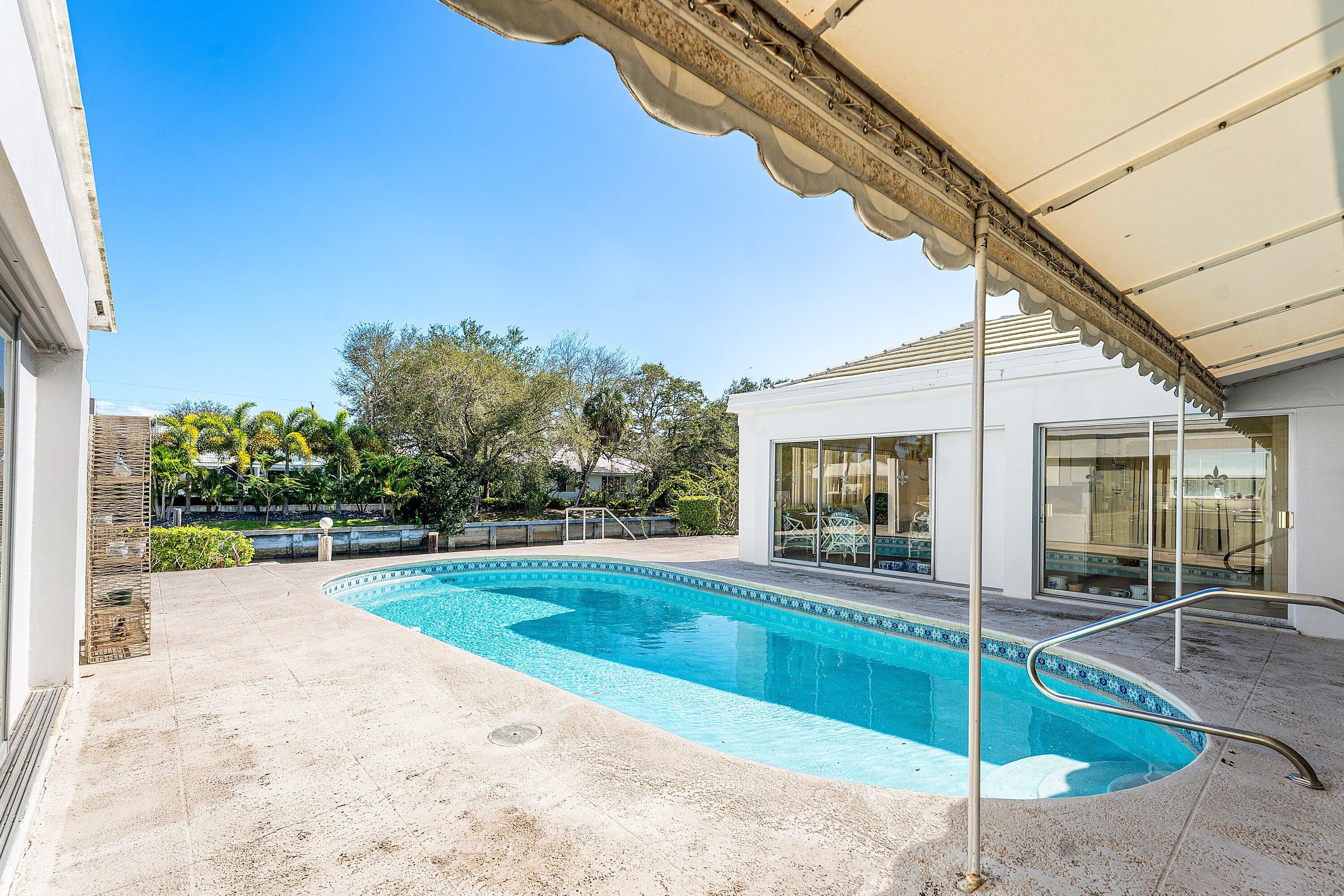 950 Mulberry Way Boca Raton, FL 33486 - Photo 14 of 23 a view of a house with backyard and porch