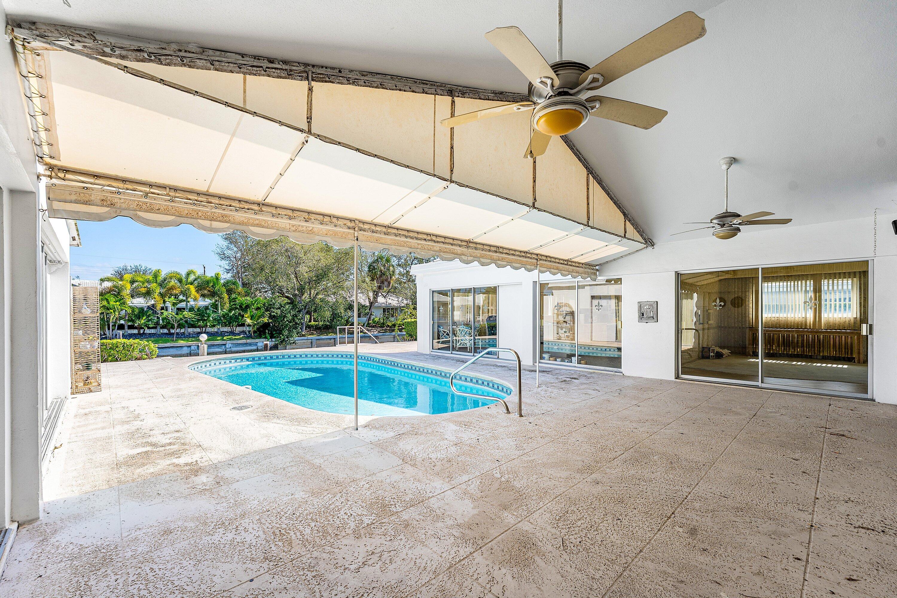 950 Mulberry Way Boca Raton, FL 33486 - Photo 10 of 23 a view of a porch with a table and chairs