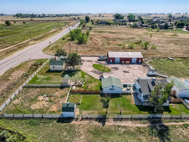 a bathroom with a sink and mirror with toilet