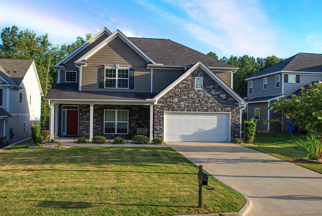 9570 Yarbrough Road Midland, GA 31820 - Photo 1 of 30 a front view of a house with a yard