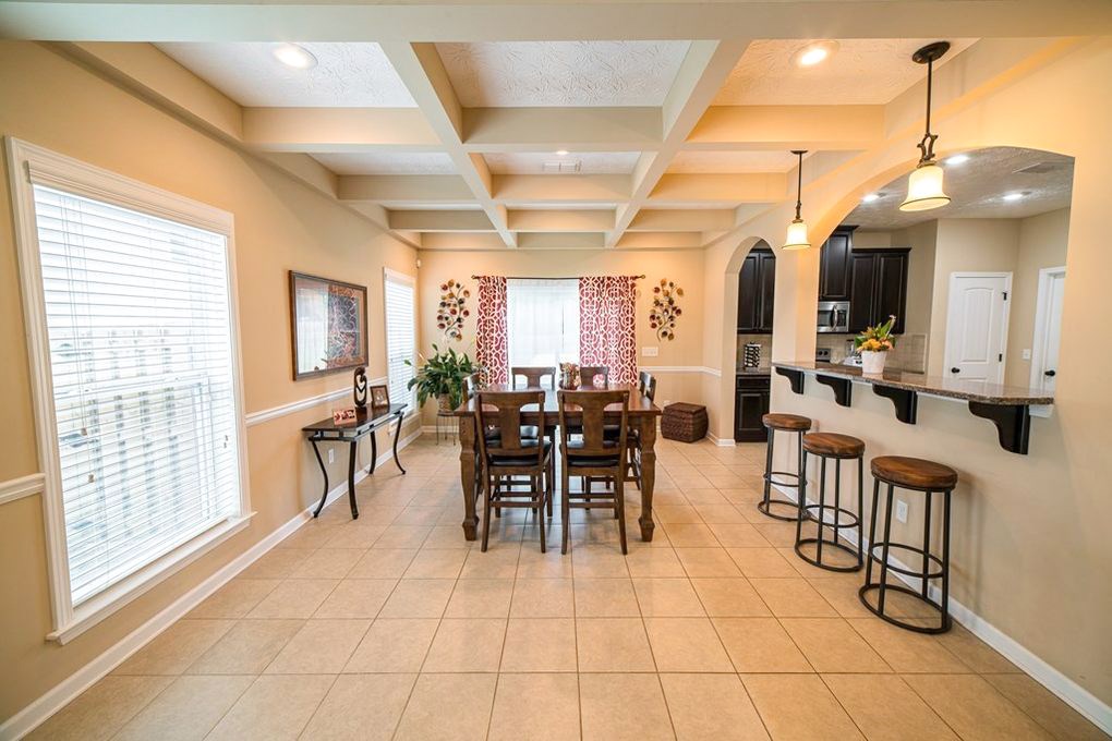 9570 Yarbrough Road Midland, GA 31820 - Photo 11 of 30 a view of a dining room with furniture and a chandelier